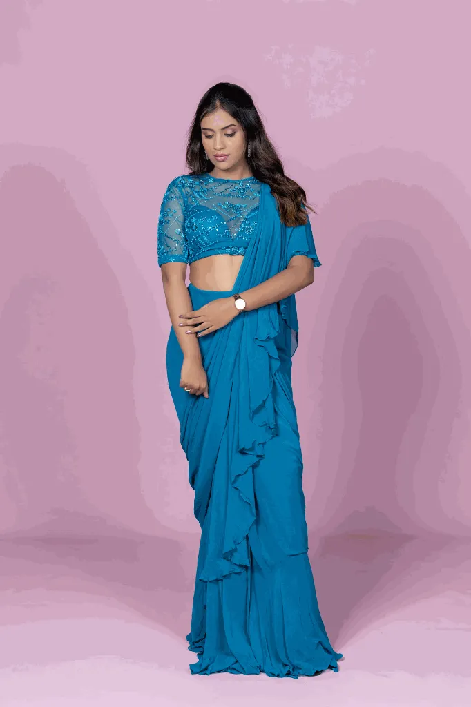 Teal ruffle saree.webp
